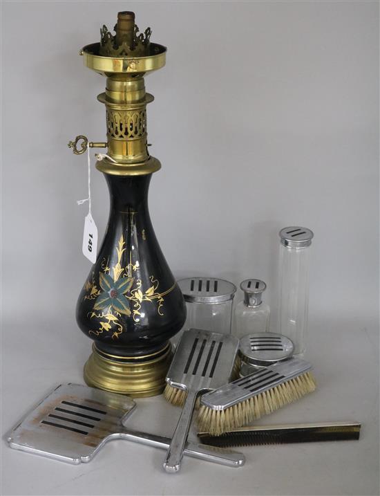A glass oil lamp, dressing table set etc